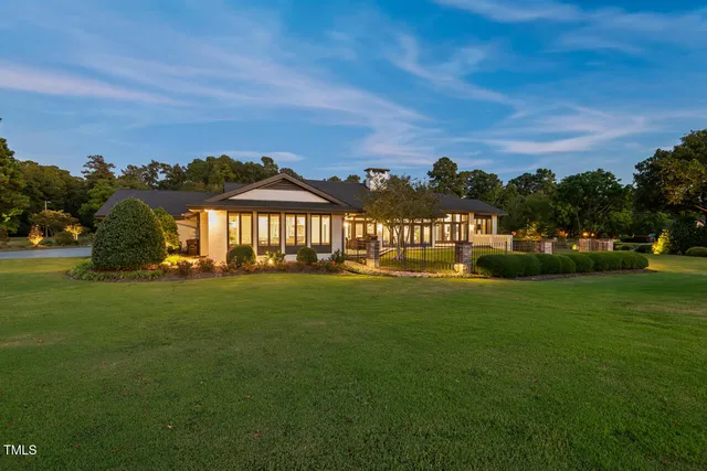a view of a big house with a big yard