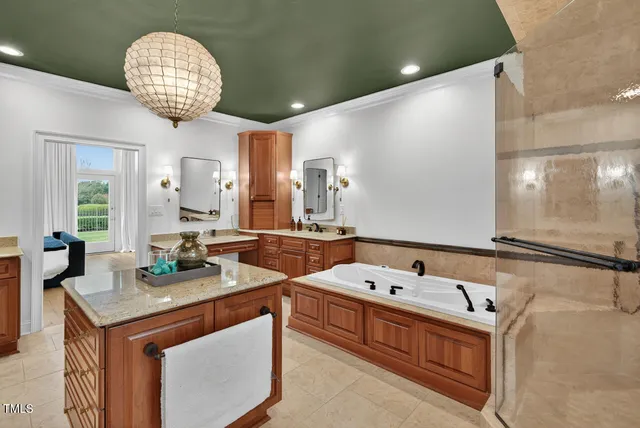 a bathroom with a granite countertop sink a toilet and shower