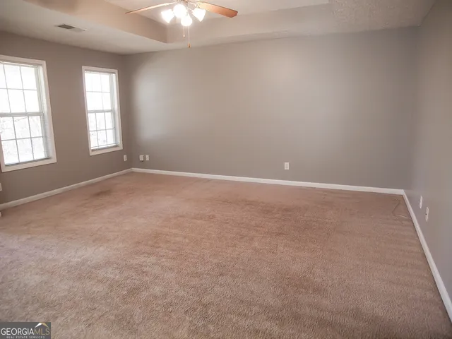 an empty room with windows