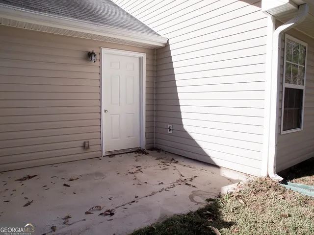 a view of a house with a small yard