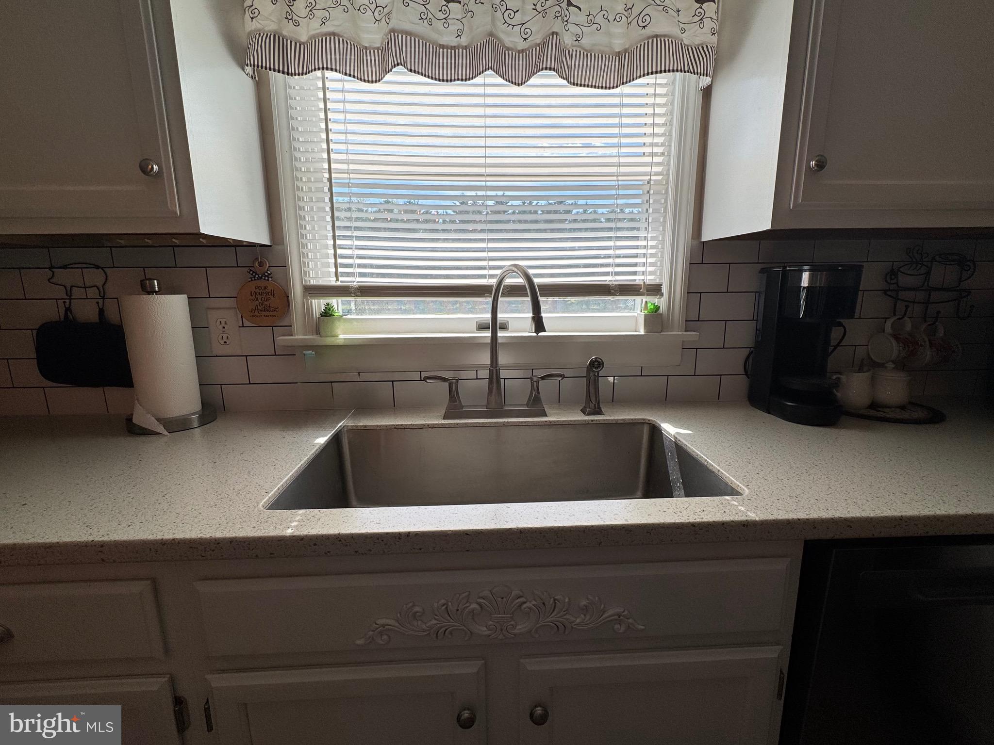 6101 Bethlehem Road Preston, MD 21655 - Photo 14 of 36 a kitchen with a sink cabinets and a window