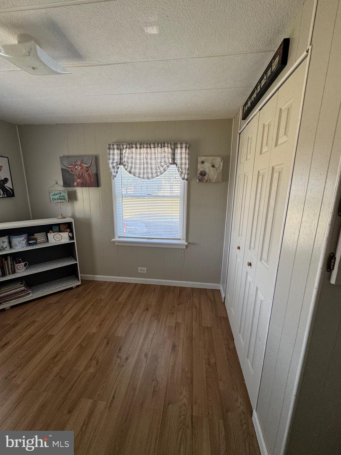 6101 Bethlehem Road Preston, MD 21655 - Photo 17 of 36 a view of an empty room with wooden floor and a window