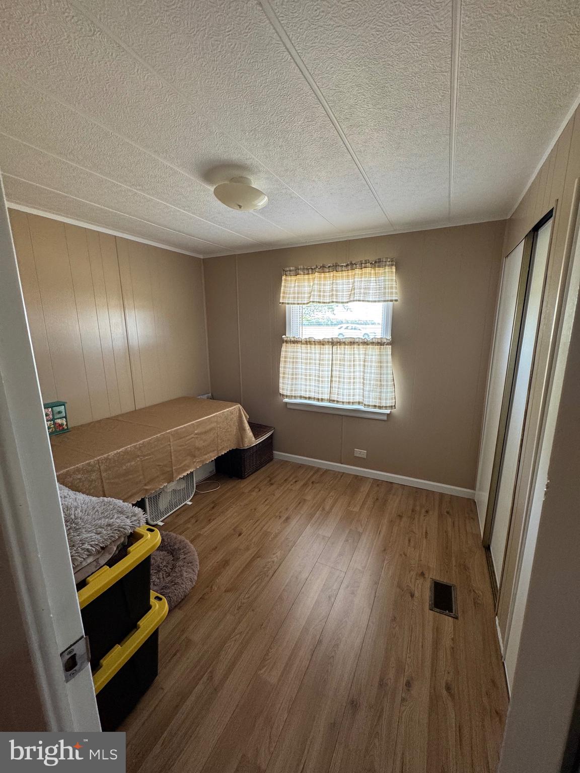 6101 Bethlehem Road Preston, MD 21655 - Photo 19 of 36 a room with wooden floor and window