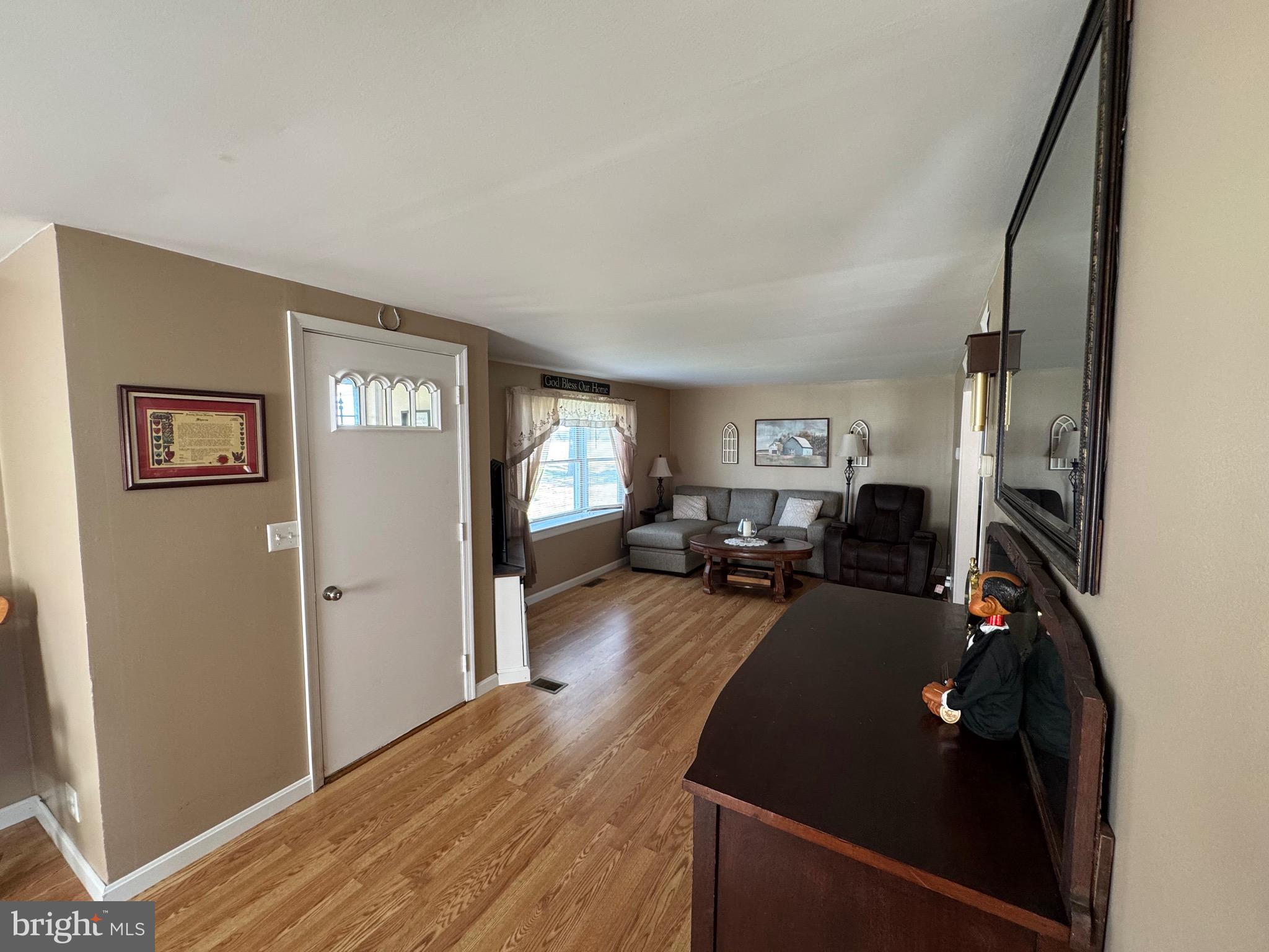 6101 Bethlehem Road Preston, MD 21655 - Photo 36 of 36 a living room with furniture window and wooden floor