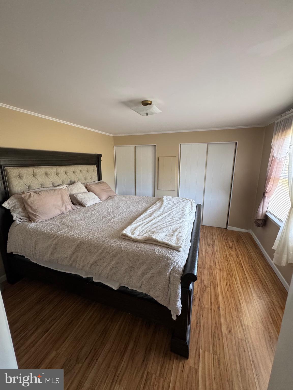 6101 Bethlehem Road Preston, MD 21655 - Photo 20 of 36 a bedroom with a bed and a flat screen tv