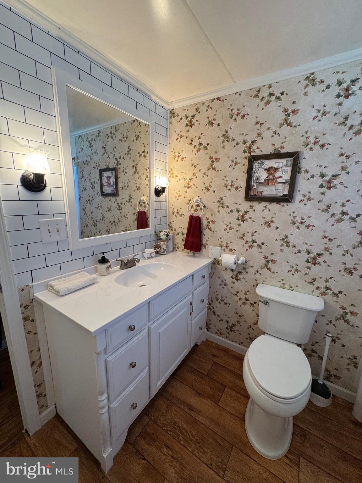 6101 Bethlehem Road Preston, MD 21655 - Photo 22 of 36 a spacious bathroom with a toilet sink and mirror