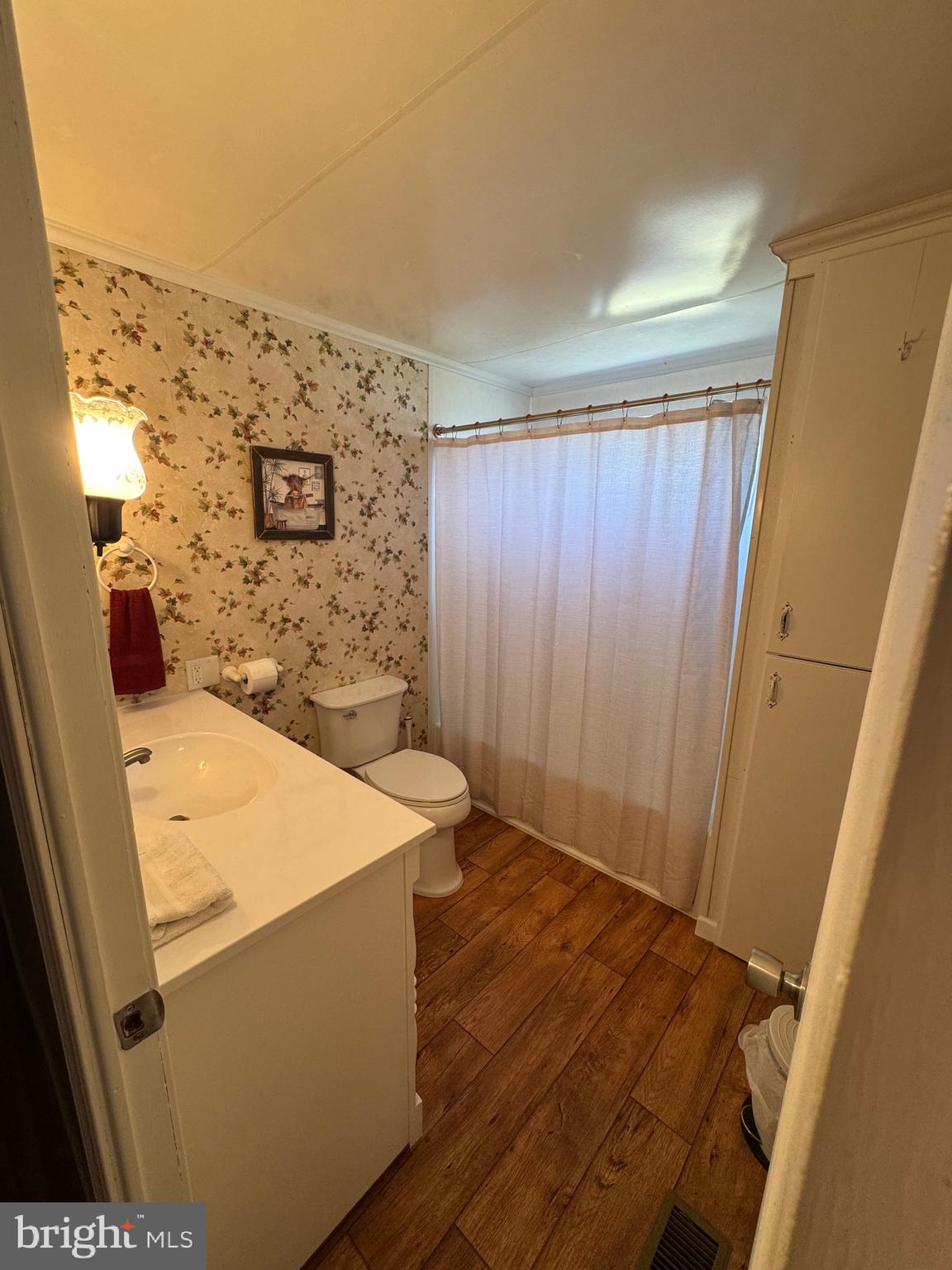 6101 Bethlehem Road Preston, MD 21655 - Photo 23 of 36 view of a room with wooden floor and cabinet
