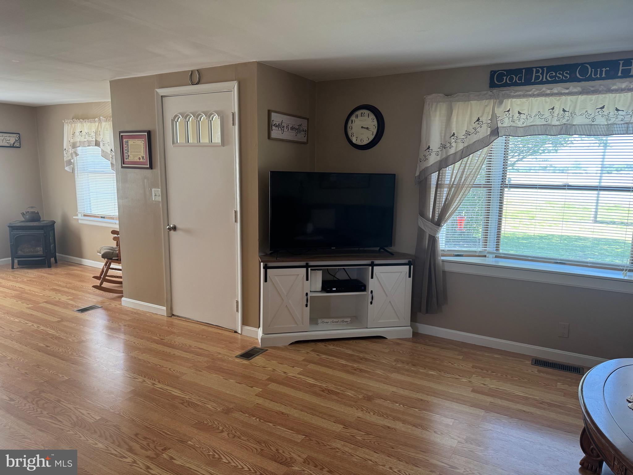 6101 Bethlehem Road Preston, MD 21655 - Photo 2 of 36 a view of a livingroom with wooden floor and a flat screen tv