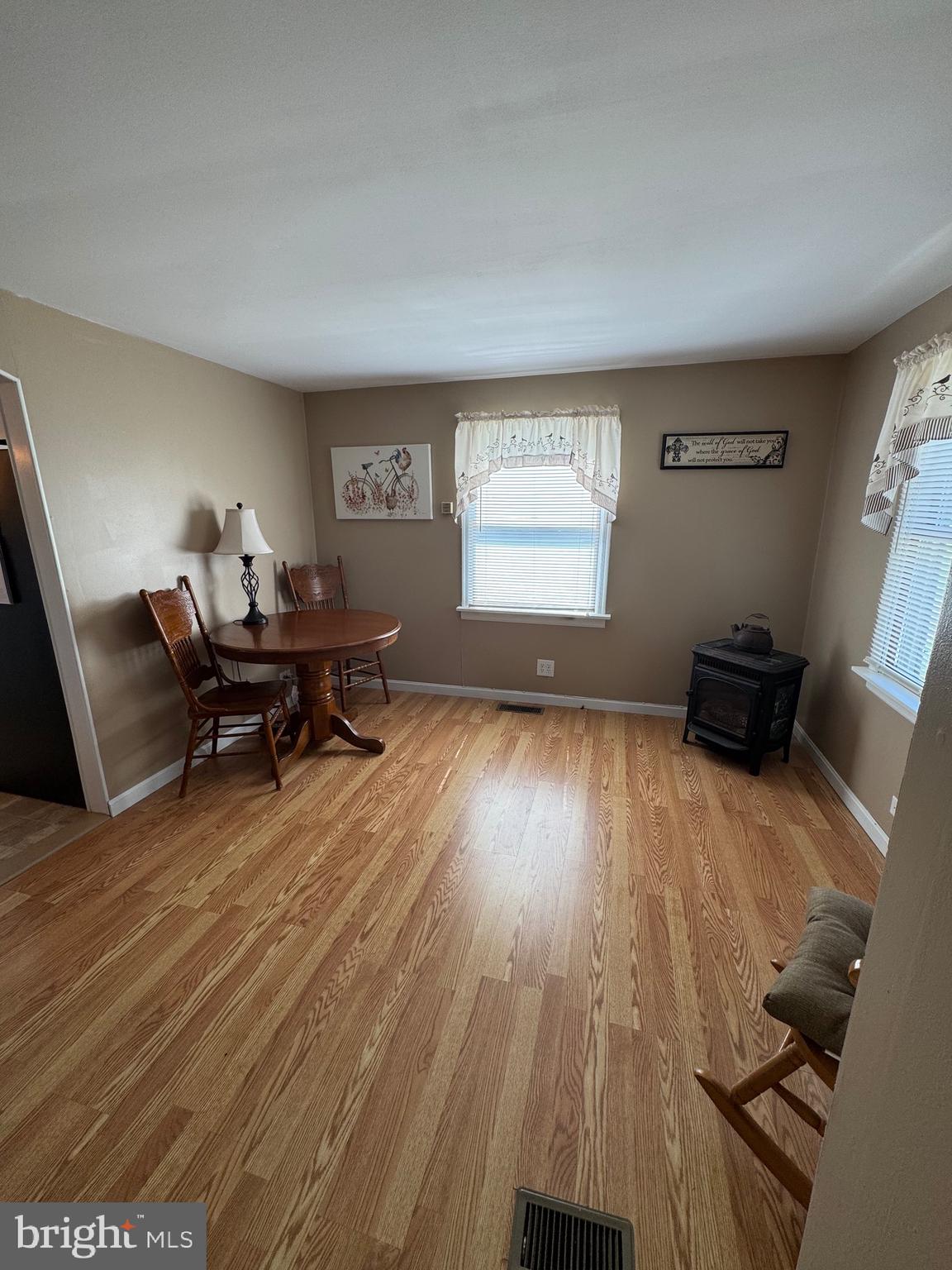 6101 Bethlehem Road Preston, MD 21655 - Photo 6 of 36 a living room with furniture and a wooden floor