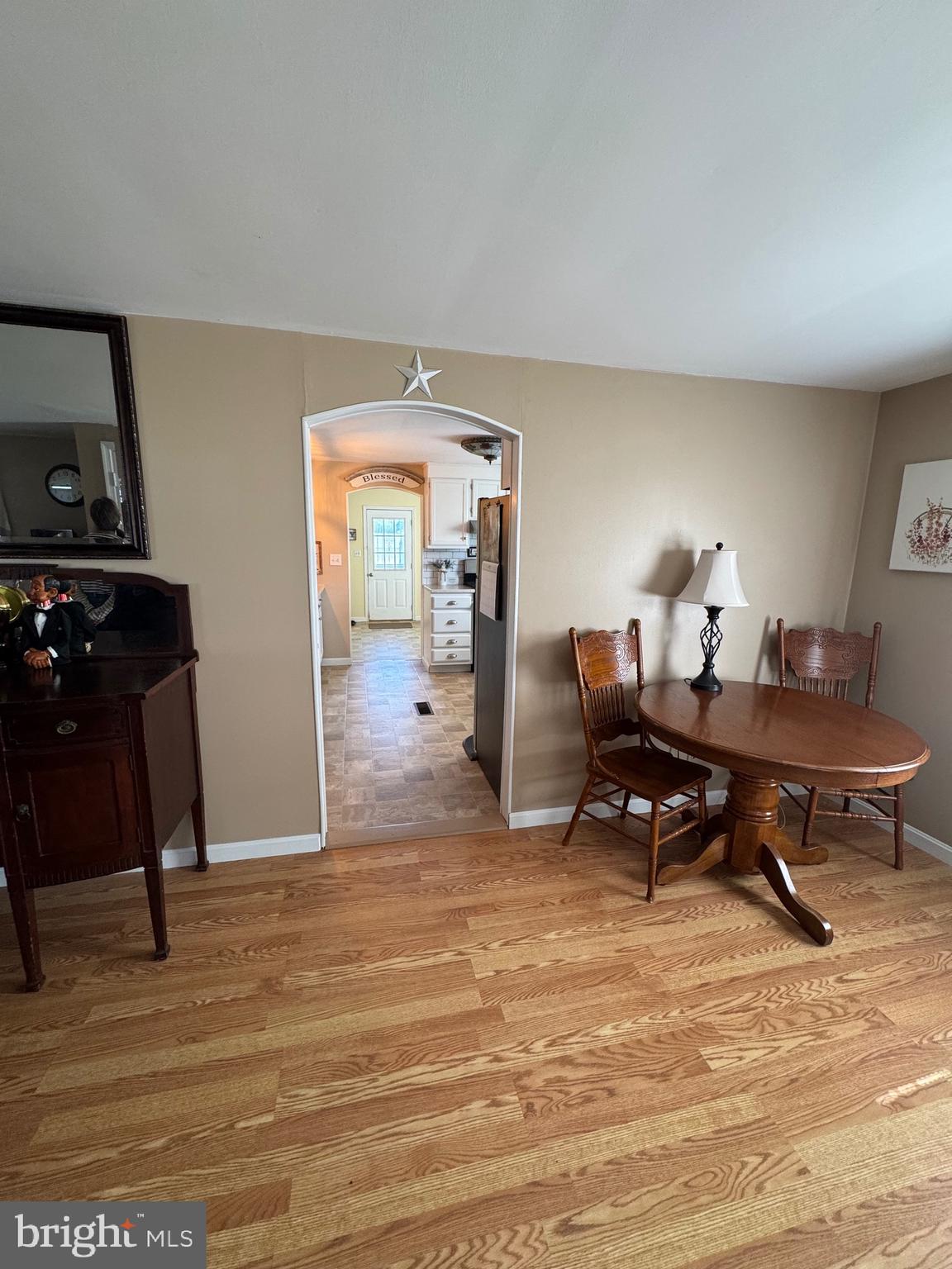 6101 Bethlehem Road Preston, MD 21655 - Photo 7 of 36 a living room with furniture a piano and a wooden floor
