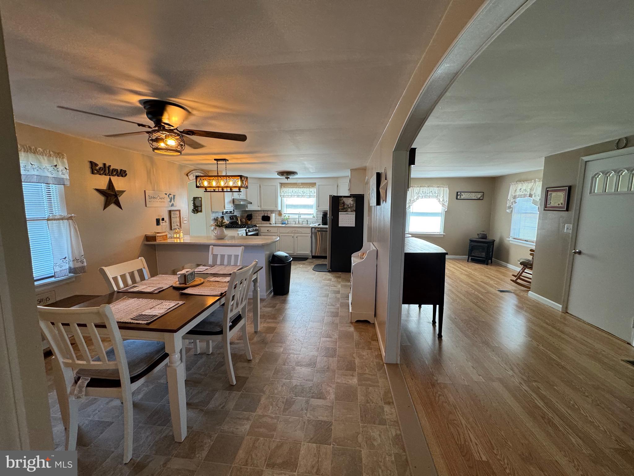 6101 Bethlehem Road Preston, MD 21655 - Photo 8 of 36 a dining room with furniture and wooden floor