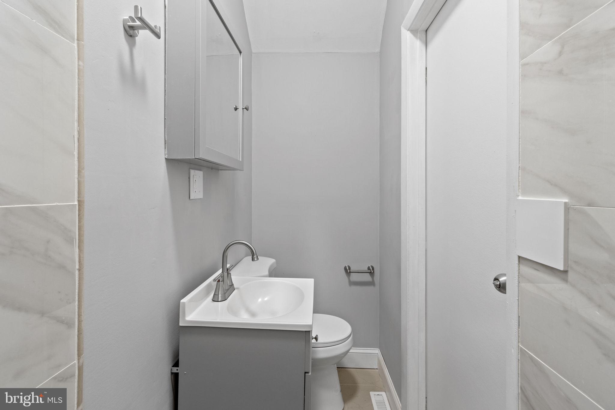 728 Christian Street, Unit 1 Philadelphia, PA 19147 - Photo 16 of 25 a bathroom with a sink toilet and shower