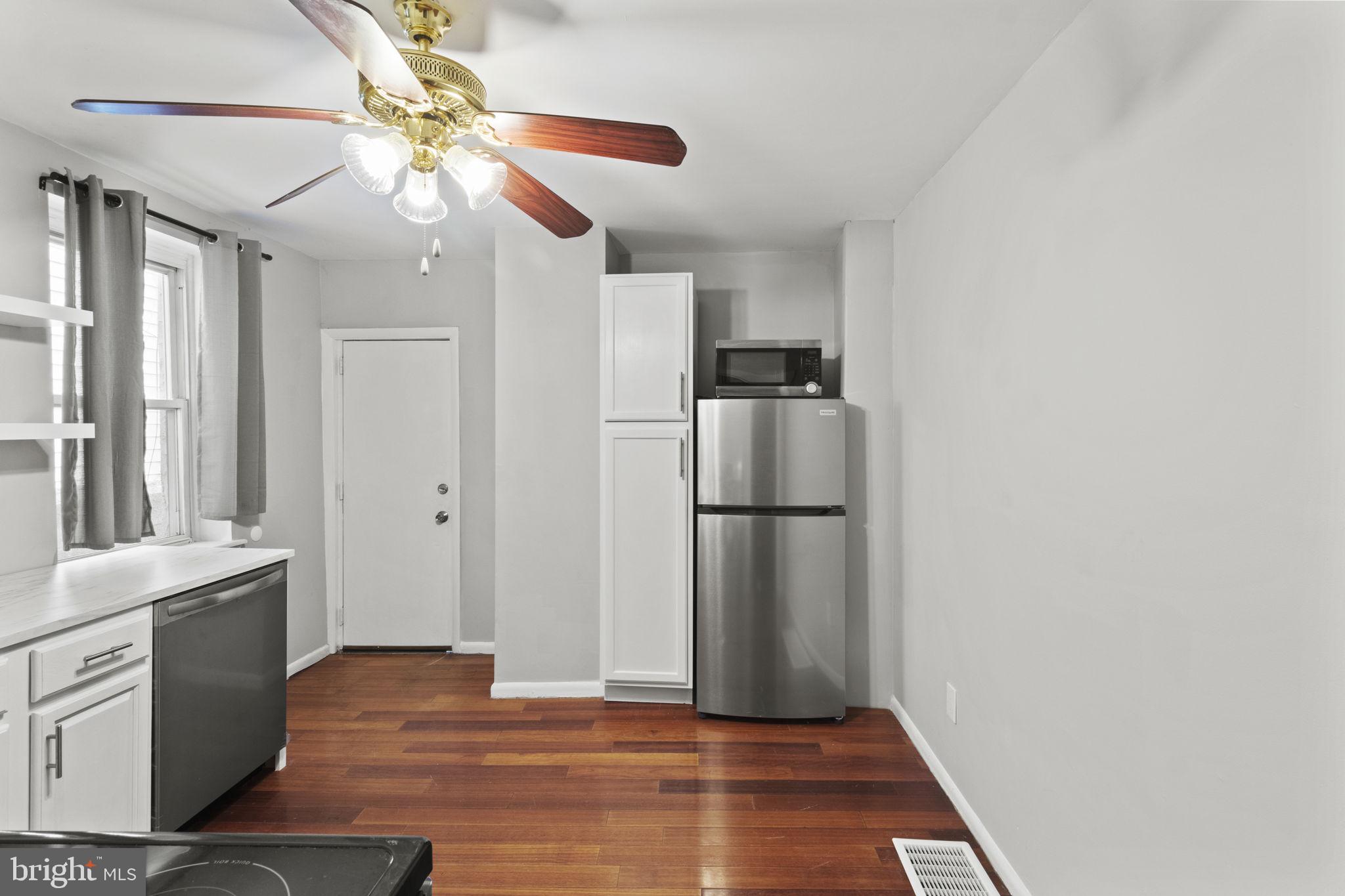 728 Christian Street, Unit 1 Philadelphia, PA 19147 - Photo 9 of 25 a view of a kitchen with a sink and refrigerator