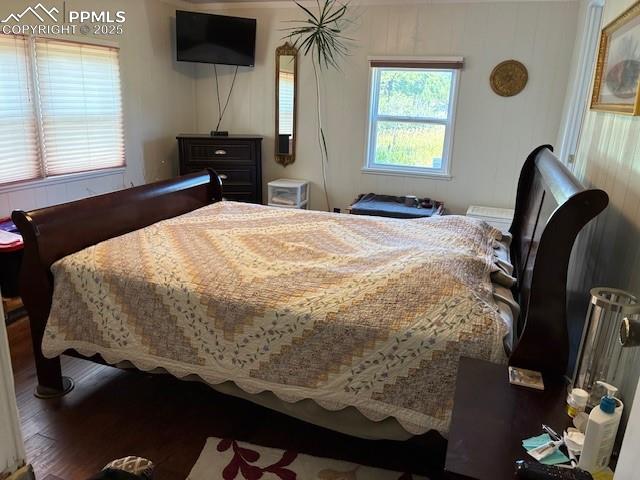 8201 Old San Isabel Road Rye, CO 81069 - Photo 7 of 30 Bedroom featuring wood finished floors and wooden walls