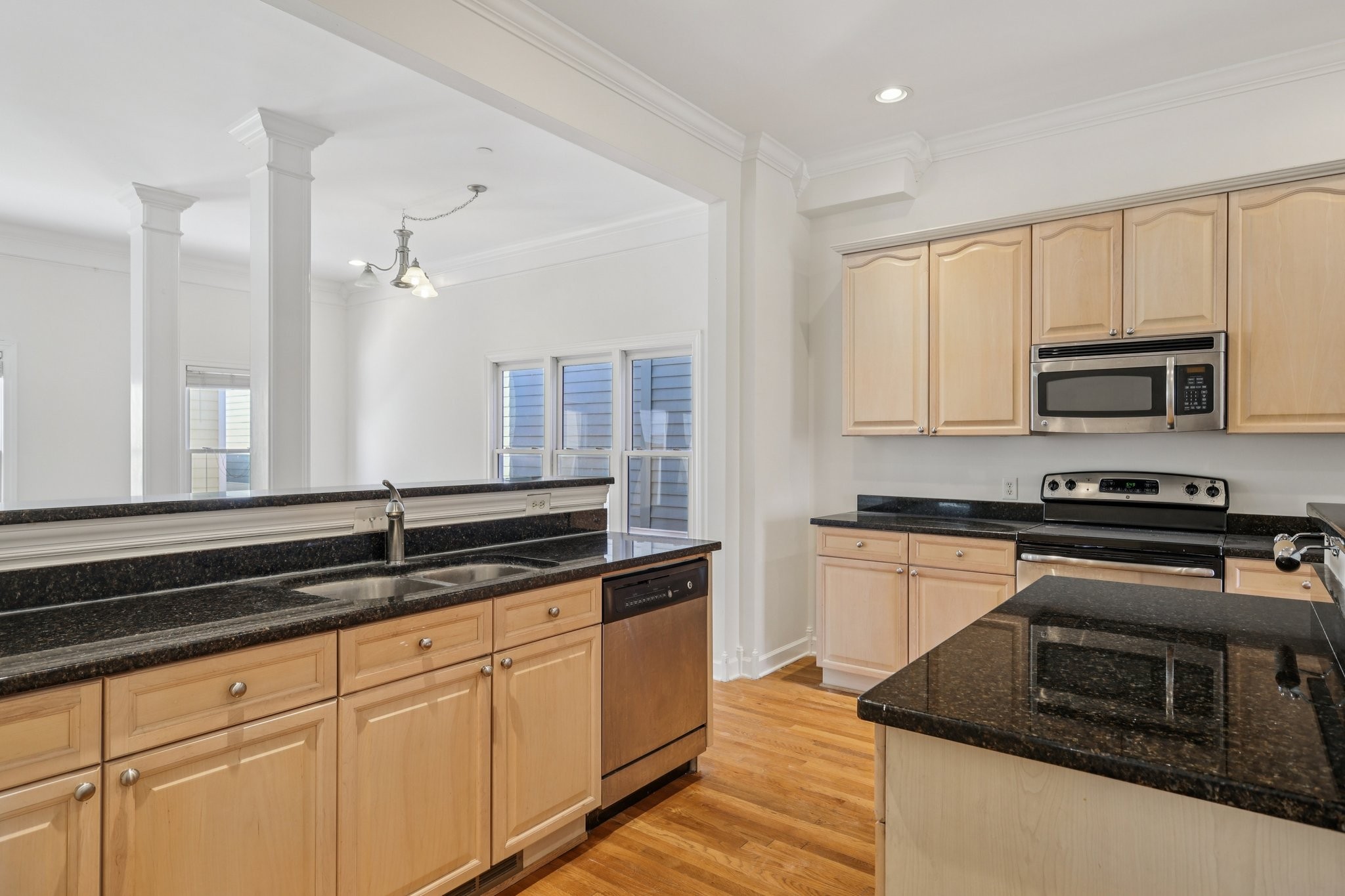 288 Augusta Avenue Pleasant View, TN 37146 - Photo 12 of 28 a kitchen with granite countertop white cabinets and stainless steel appliances