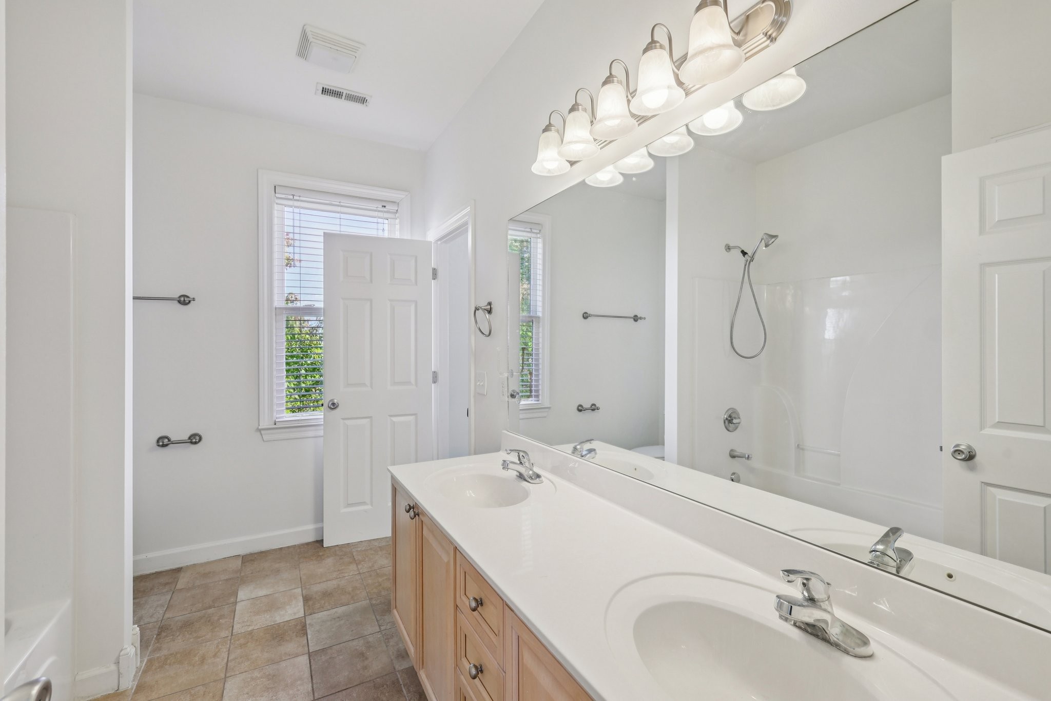 288 Augusta Avenue Pleasant View, TN 37146 - Photo 17 of 28 a bathroom with a sink a double vanity and shower