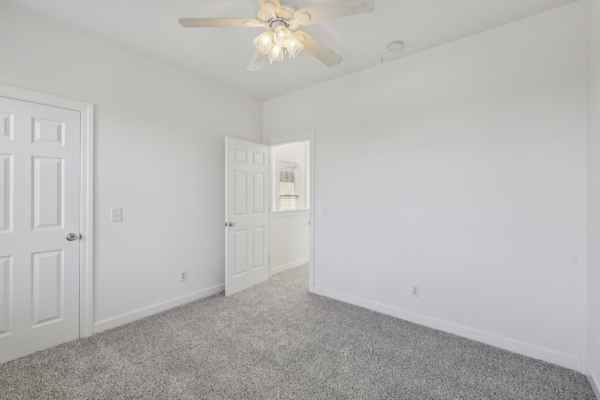 288 Augusta Avenue Pleasant View, TN 37146 - Photo 20 of 28 an empty room with a chandelier fan