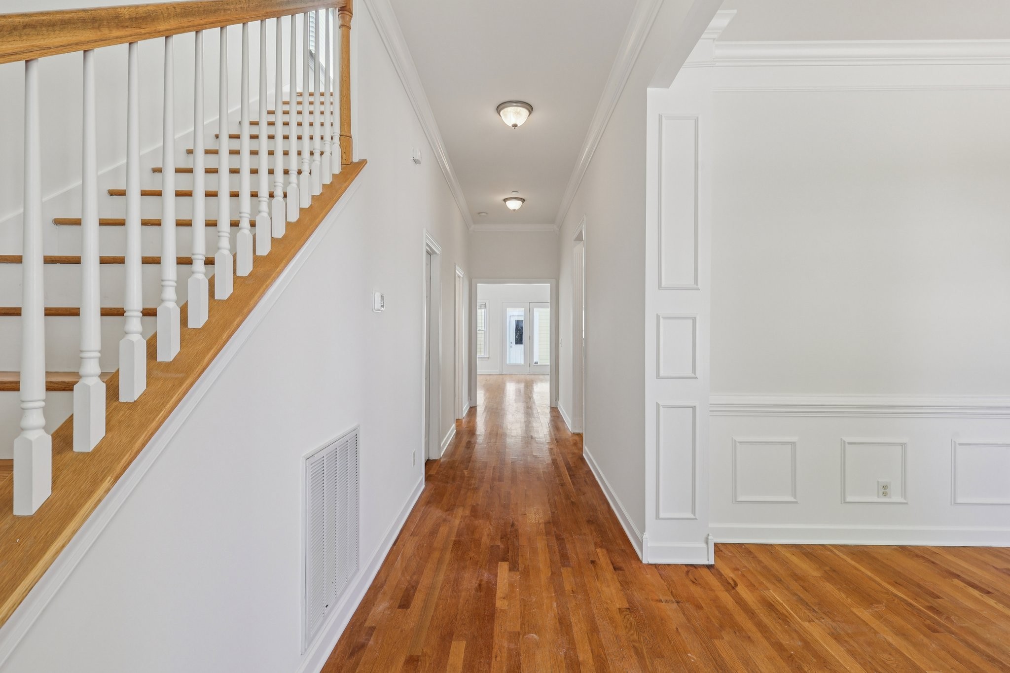 288 Augusta Avenue Pleasant View, TN 37146 - Photo 3 of 28 a view of a hallway with wooden floor and staircase