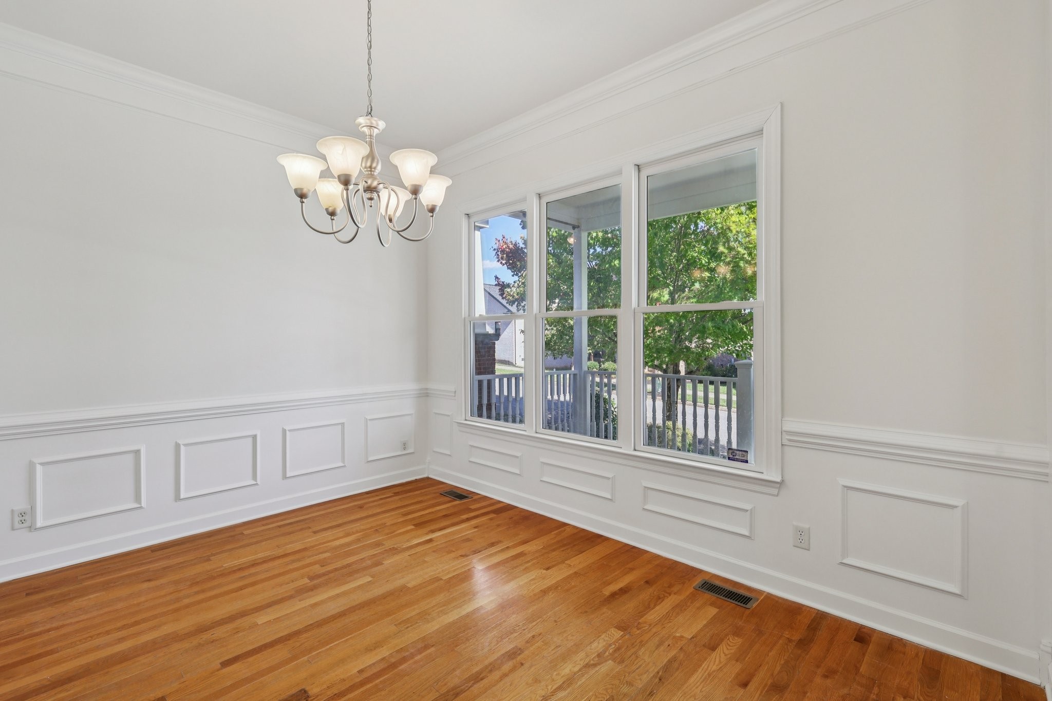 288 Augusta Avenue Pleasant View, TN 37146 - Photo 5 of 28 a view of an empty room with a window and wooden floor