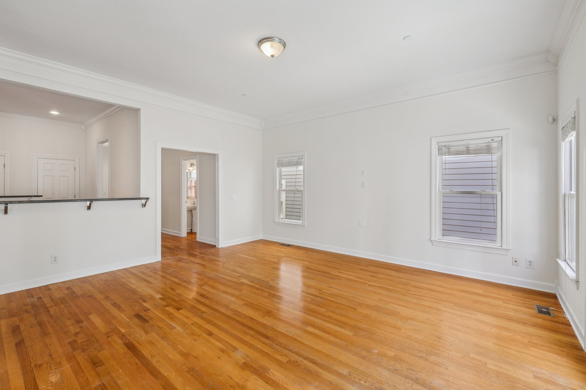 288 Augusta Avenue Pleasant View, TN 37146 - Photo 8 of 28 a view of an empty room with wooden floor and a window