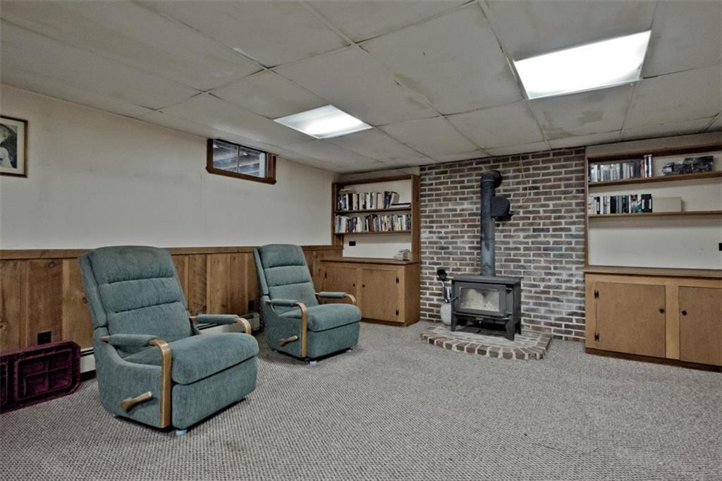 27 Old County Road Scarborough, ME 04074 - Photo 21 of 32 Basement familyroom with hearth and...