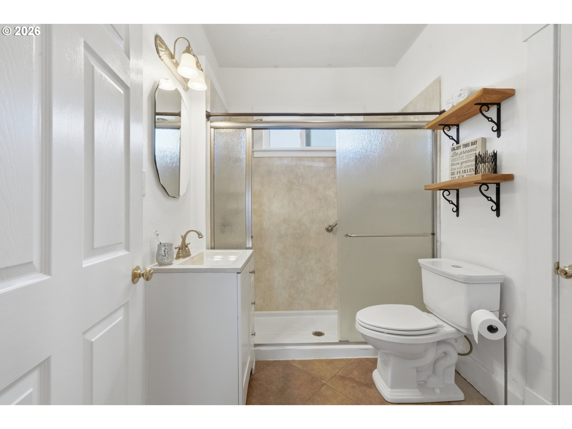 1802 8th Street Tillamook, OR 97141 - Photo 20 of 37 a bathroom with a toilet sink and shower