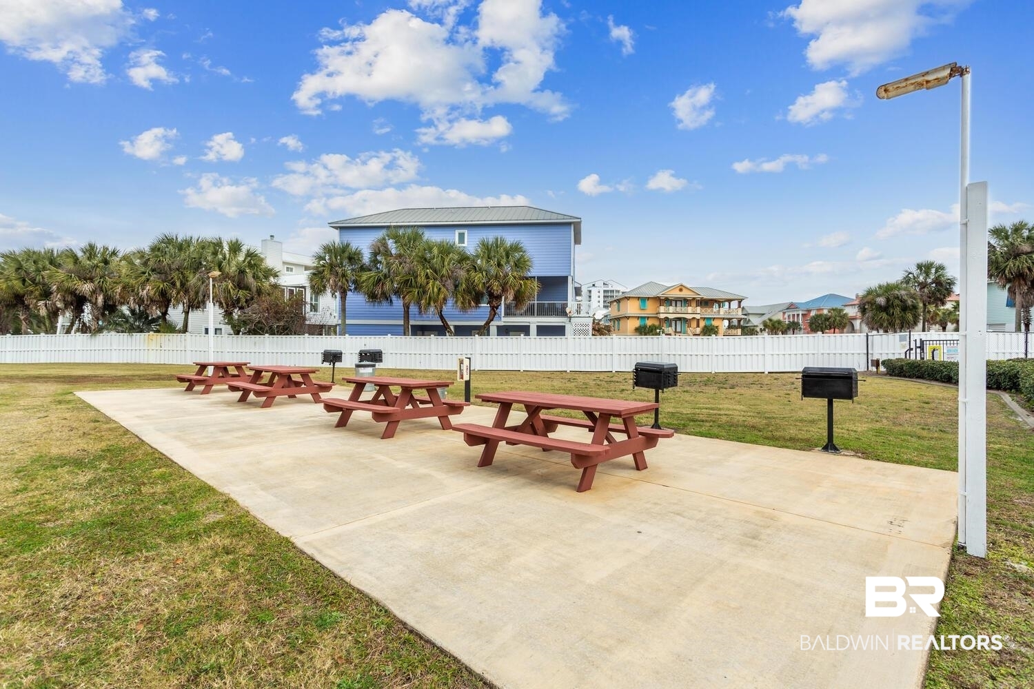 13551 Johnson Beach Road, Unit 112E Pensacola, FL 32507 - Photo 27 of 42 View of property's community featuring a patio area and a lawn