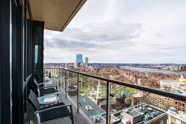 a view of a balcony with wooden floor