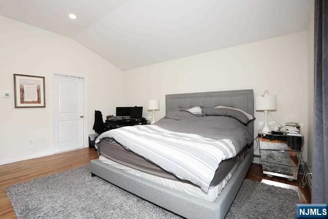 84 12th Street Cresskill, NJ 07626 - Photo 28 of 45 a bedroom with a bed and wooden floor
