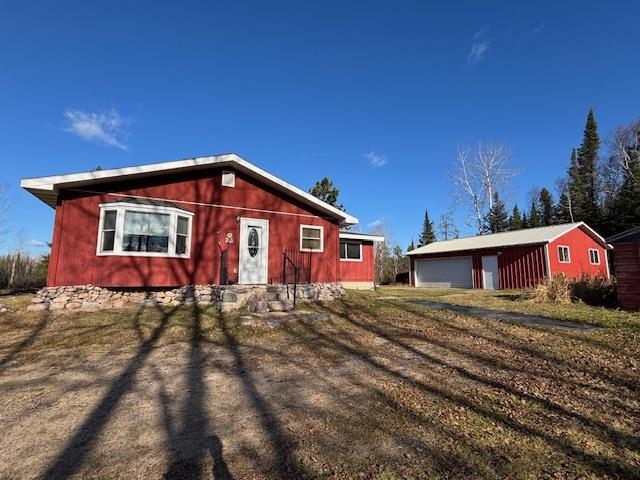 11452 Cooper Road Chisholm, MN 55719 - Photo 12 of 14 View of front of property with an outbuilding and a garage