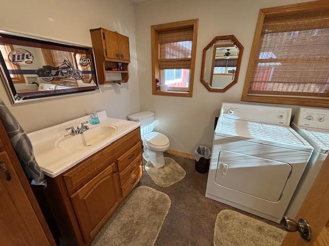 11452 Cooper Road Chisholm, MN 55719 - Photo 8 of 14 Bathroom with vanity and washer and dryer