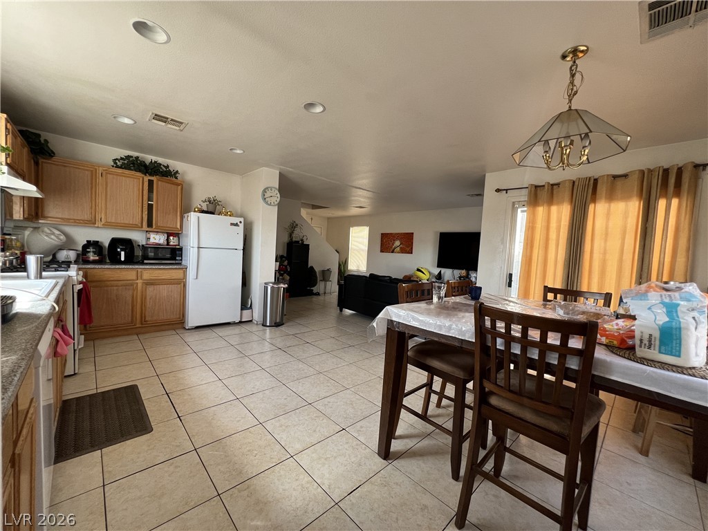 5698 Doubleday Street Las Vegas, NV 89118 - Photo 12 of 24 Dining room with light tile patterned flooring and recessed lighting