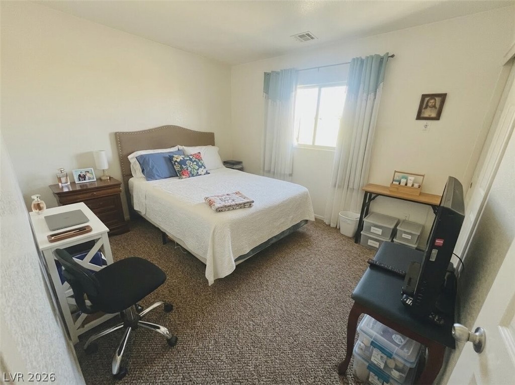 5698 Doubleday Street Las Vegas, NV 89118 - Photo 14 of 24 Bedroom with dark colored carpet