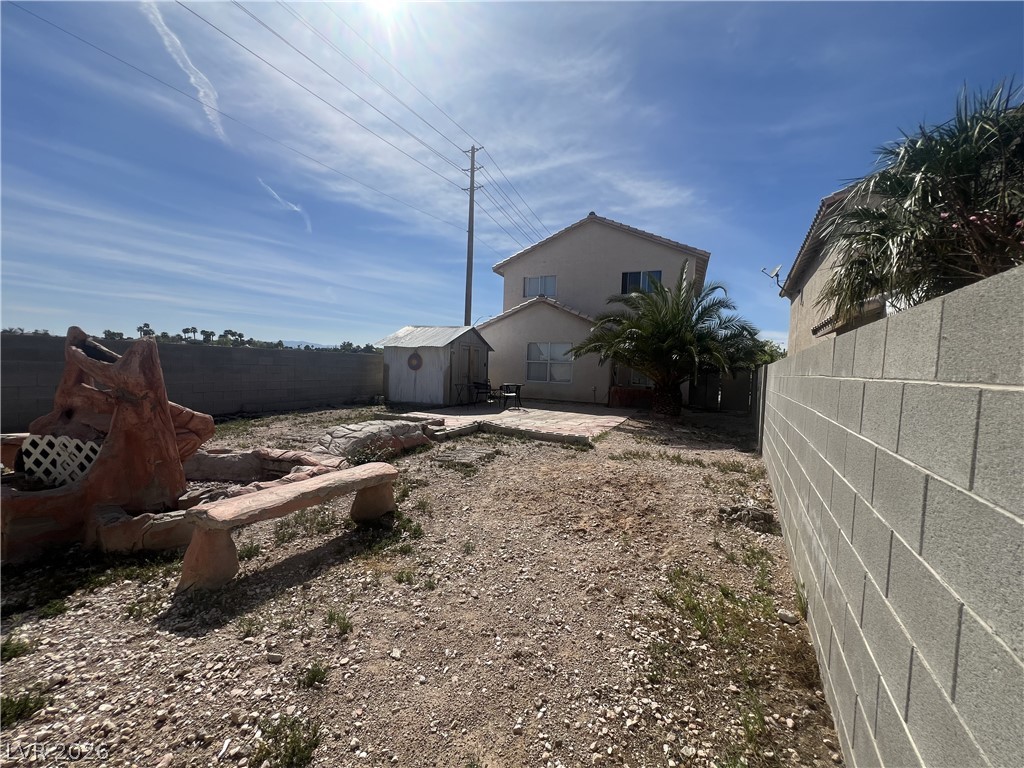 5698 Doubleday Street Las Vegas, NV 89118 - Photo 19 of 24 Fenced backyard featuring a storage unit