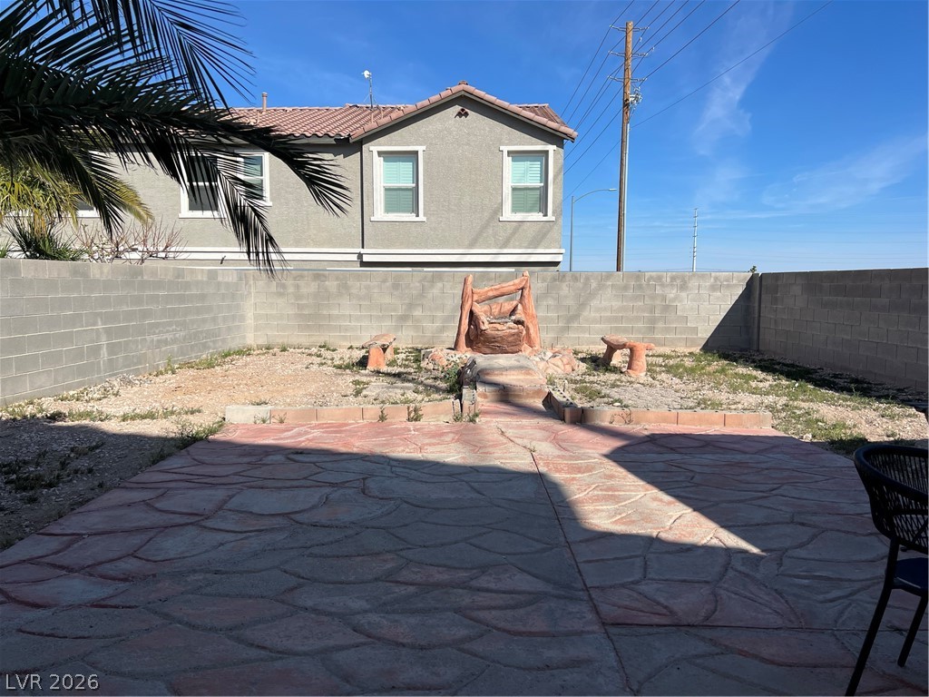 5698 Doubleday Street Las Vegas, NV 89118 - Photo 21 of 24 Fenced backyard with a patio