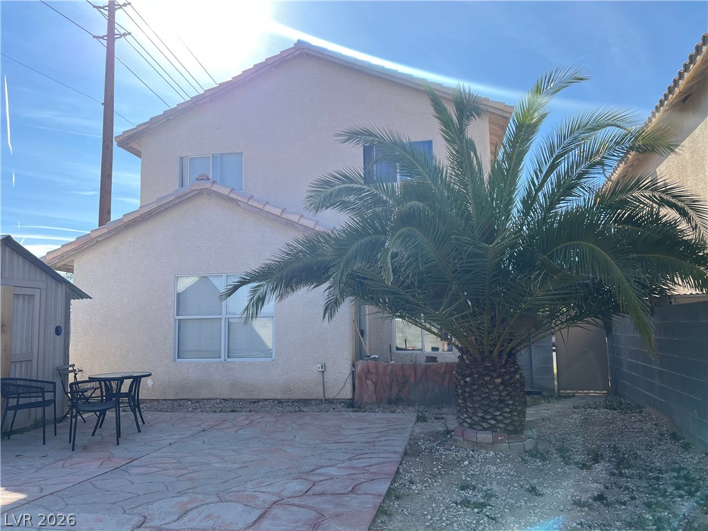 5698 Doubleday Street Las Vegas, NV 89118 - Photo 24 of 24 Rear view of property with stucco siding, a patio, a shed, and a fenced backyard