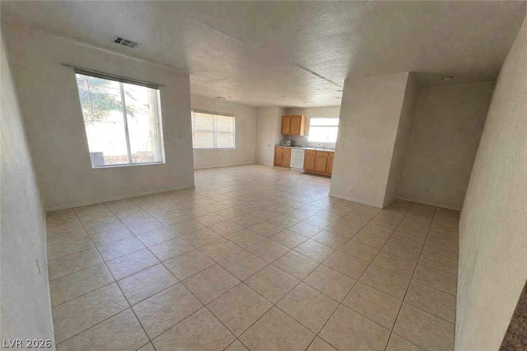 5698 Doubleday Street Las Vegas, NV 89118 - Photo 5 of 24 Unfurnished living room featuring light tile patterned floors