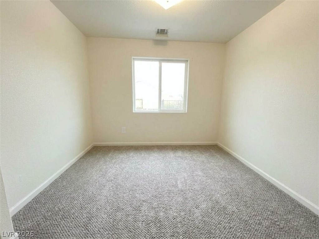5698 Doubleday Street Las Vegas, NV 89118 - Photo 8 of 24 Unfurnished room featuring baseboards and carpet floors