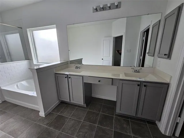 a bathroom with a sink a vanity and a mirror