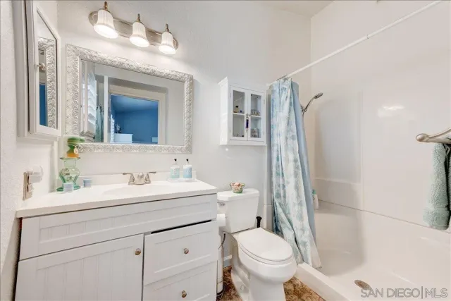a view of a porch with furniture and a yard