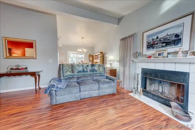 a view of a patio with a table and chairs under an umbrella