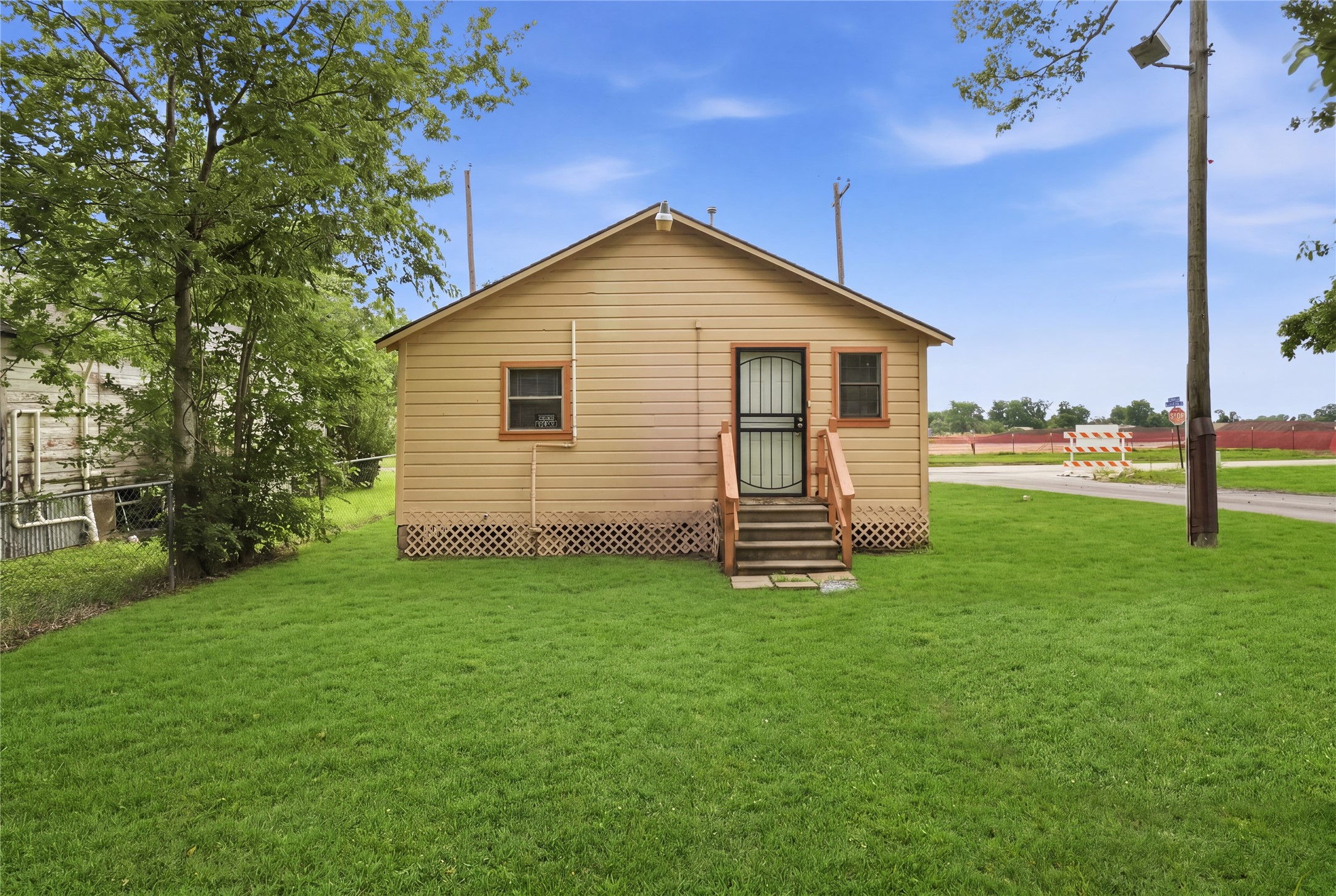 101 Outlar Street Wharton, TX 77488 - Photo 19 of 40 a view of a house with a yard