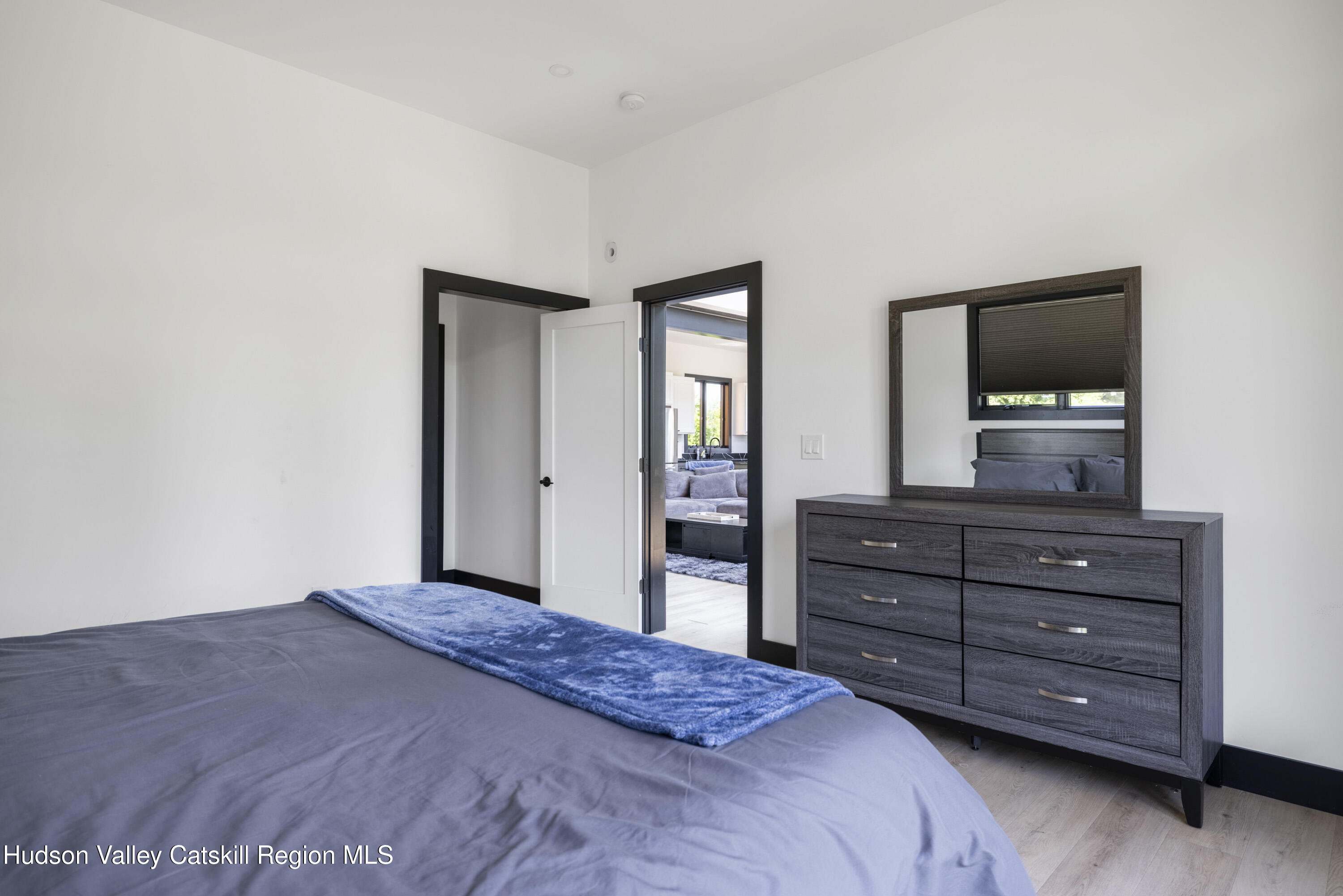 4 Goff Road Windham, NY 12496 - Photo 17 of 68 a bedroom with a bed and a dresser in it