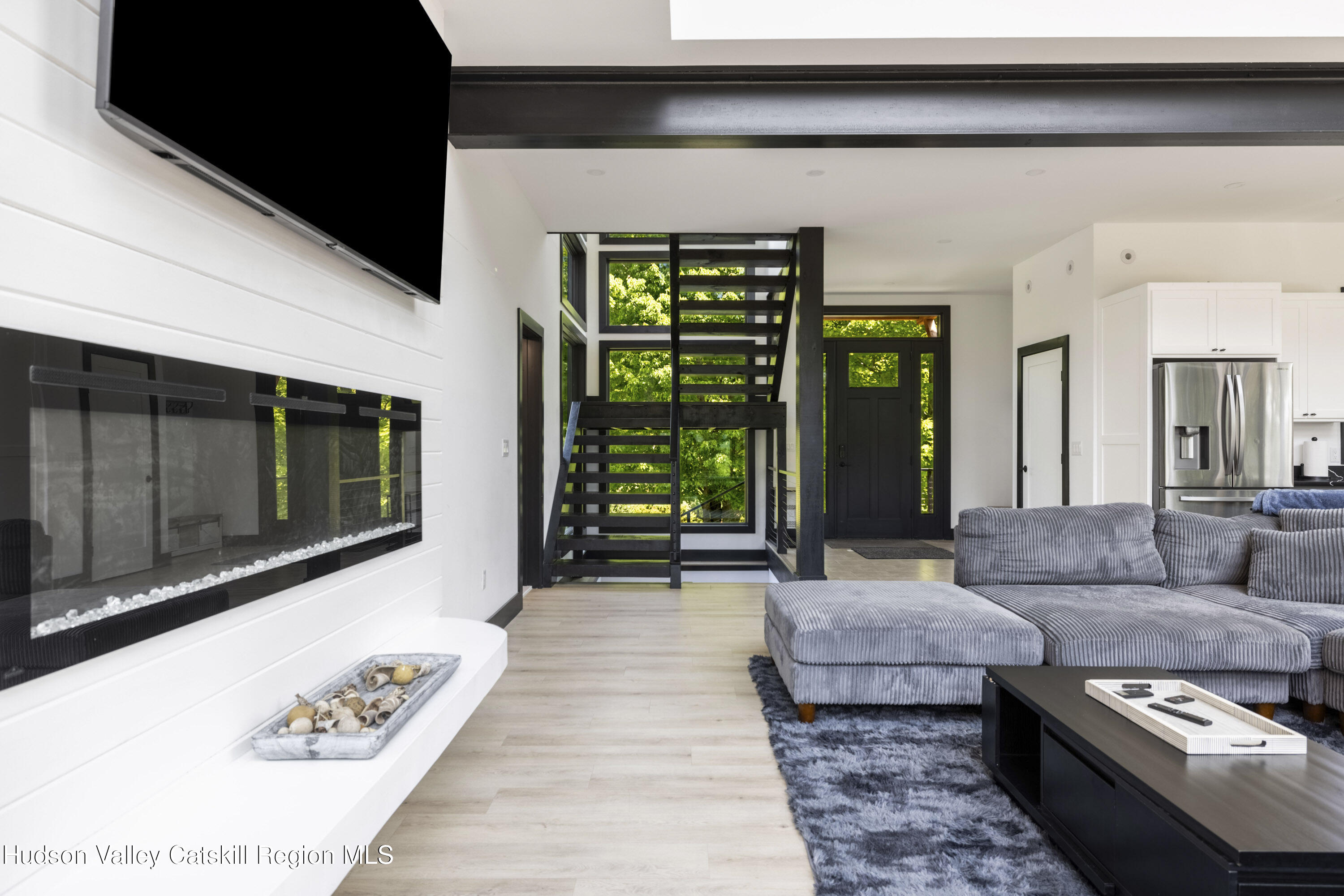 4 Goff Road Windham, NY 12496 - Photo 19 of 68 a living room with furniture and a flat screen tv