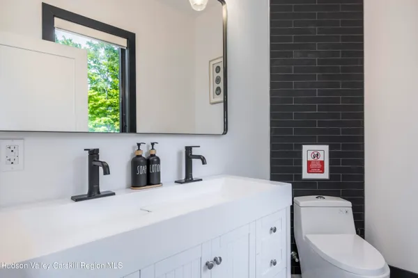 a view of a balcony with wooden floor and fence