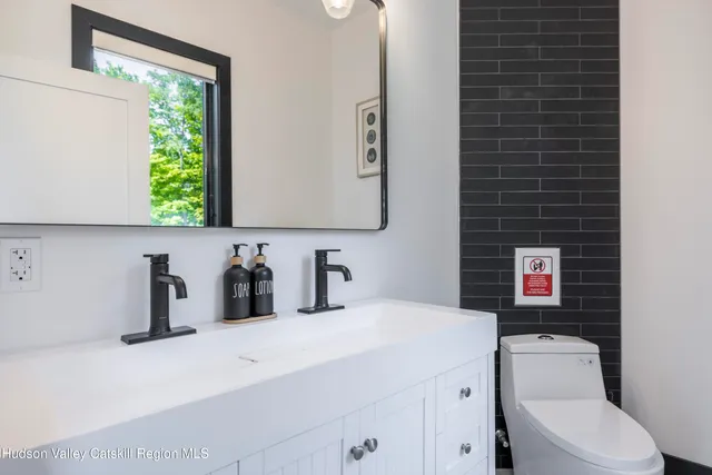 a view of a balcony with wooden floor and fence