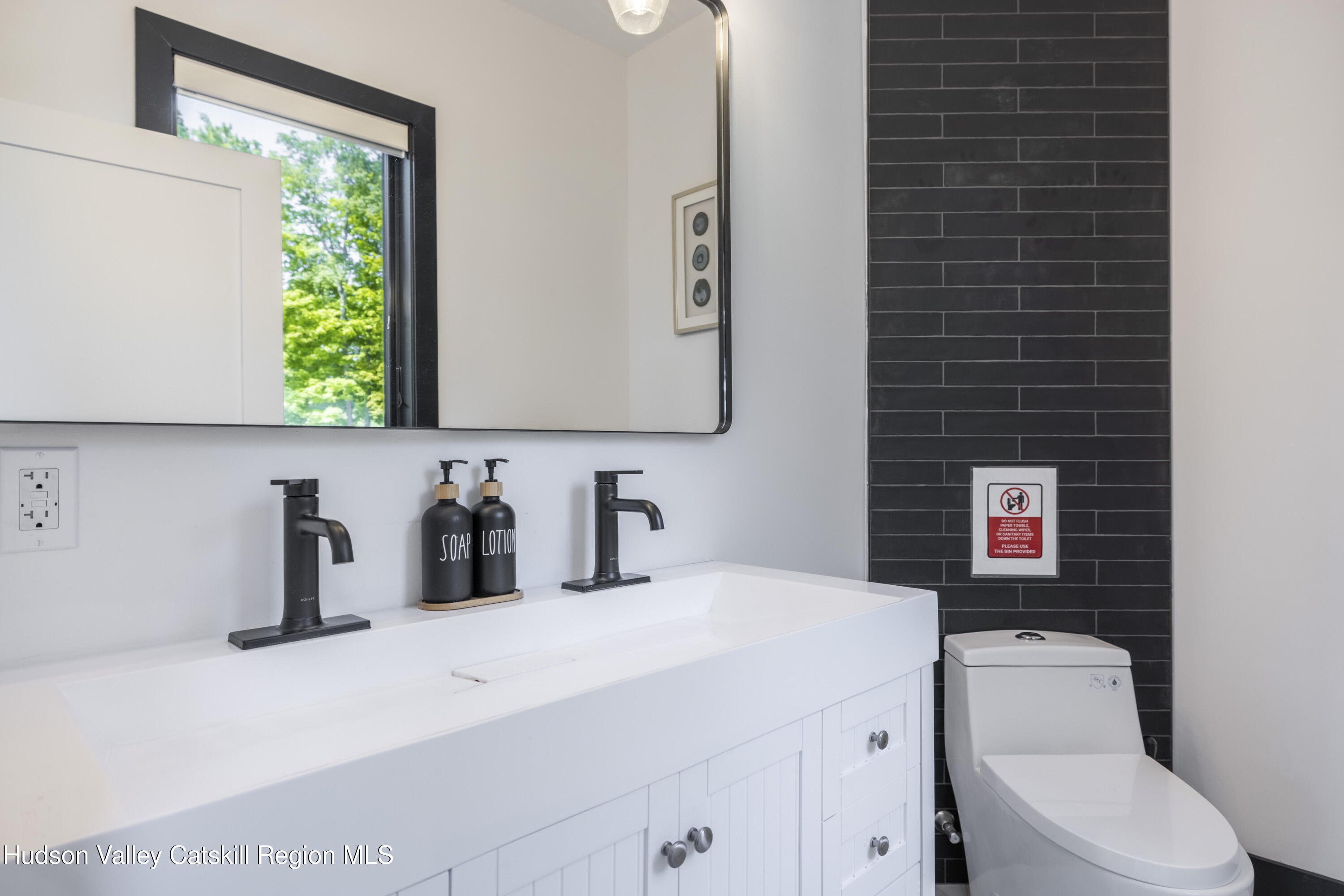 4 Goff Road Windham, NY 12496 - Photo 20 of 68 a bathroom with a toilet a sink and a window