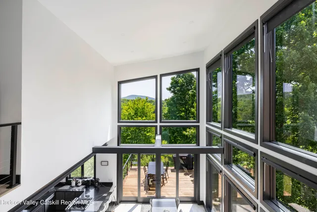 a view of a room that has a large window