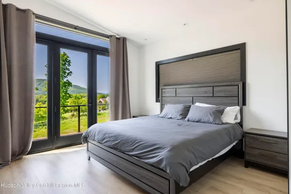 a bedroom with a bed and a cabinets