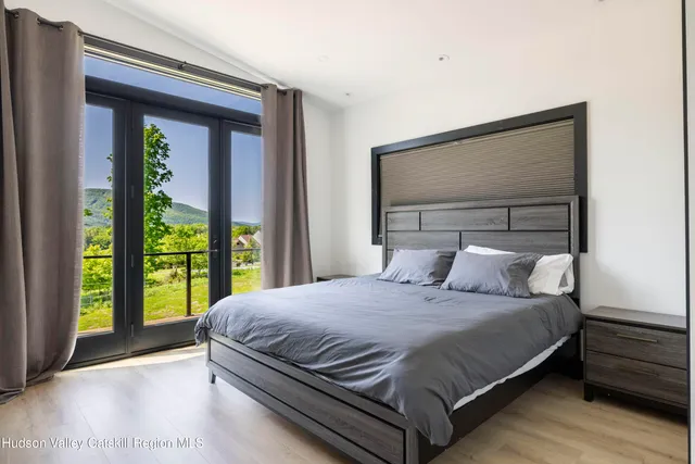 a bedroom with a bed and a cabinets